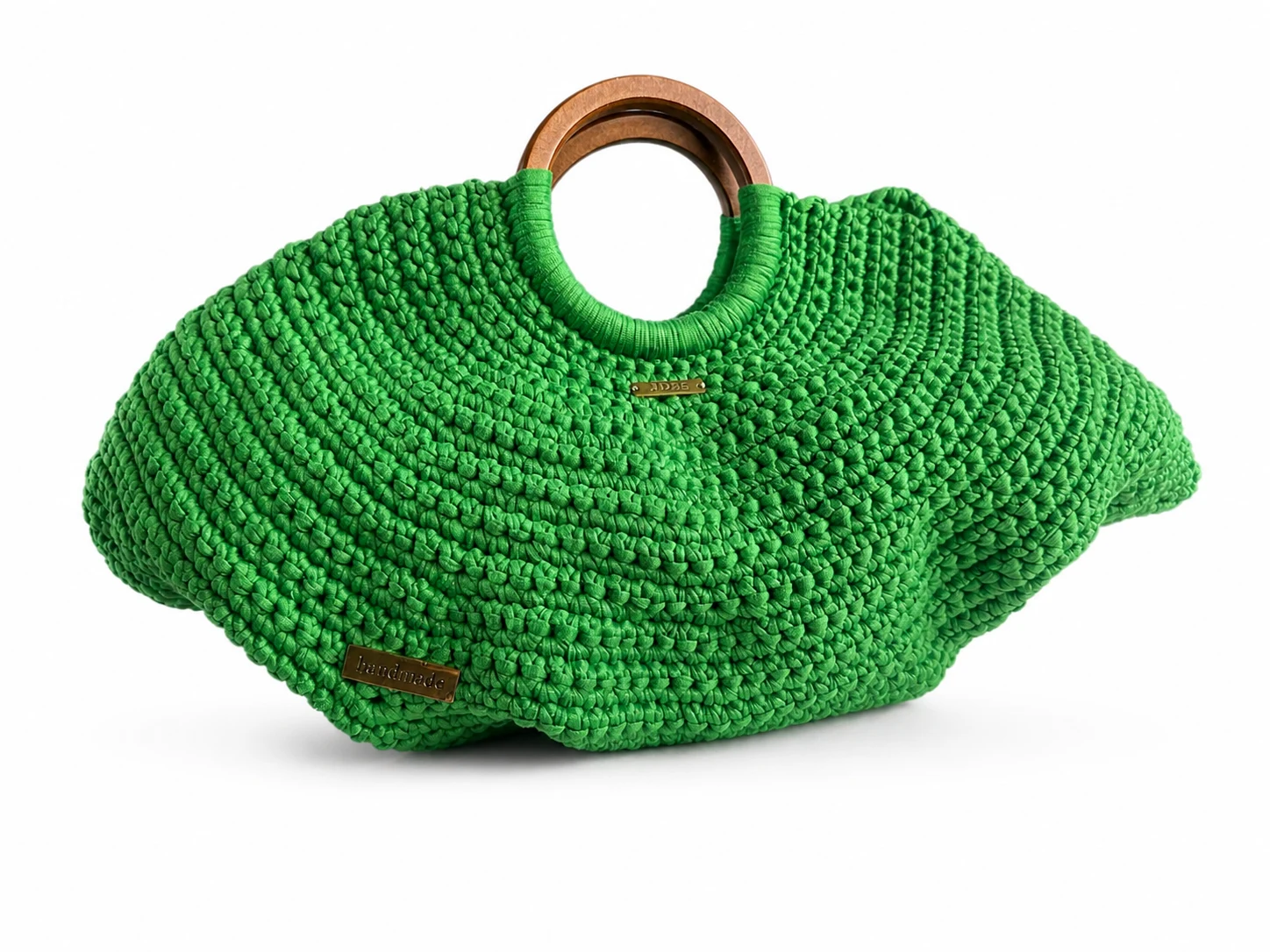 Bolso Arco Esmeralda tejido en verde con asas rígidas redondeadas